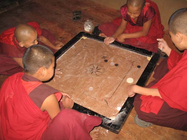 Monks playing carom (board game)