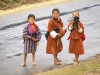Bhutanese boys holding puppies